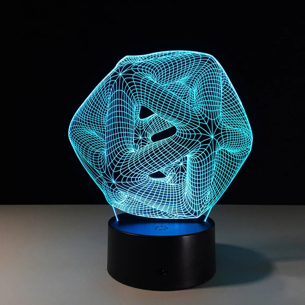 Blue illuminated abstract shape night lamp on a black base