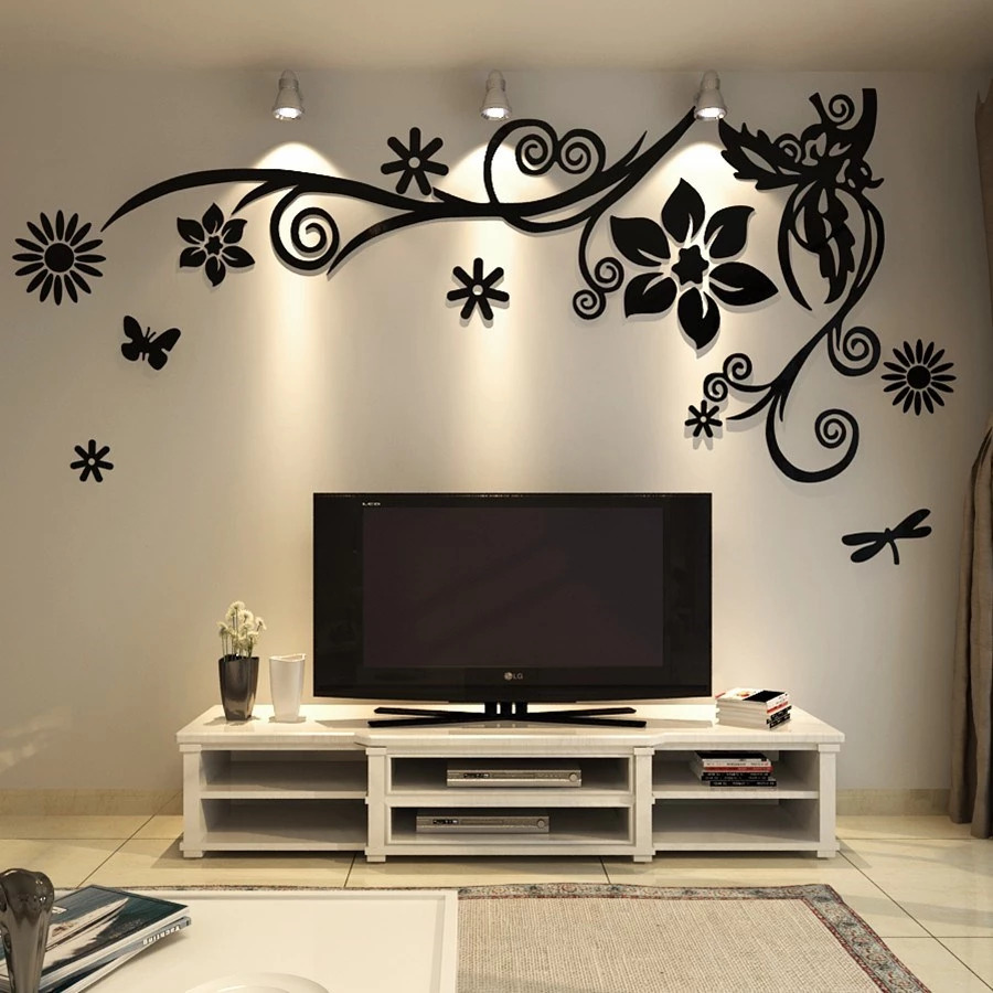 Floral wall decoration with black cutout flowers and leaves